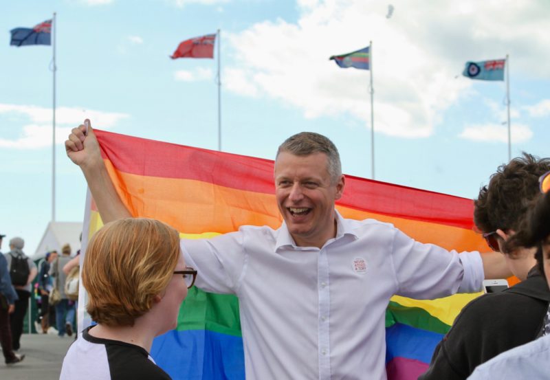Luke Pollard holding a rainbow flag