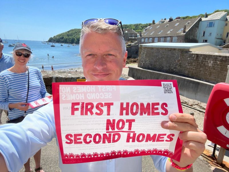 Luke Holding "First Homes not Second Homes" Sign
