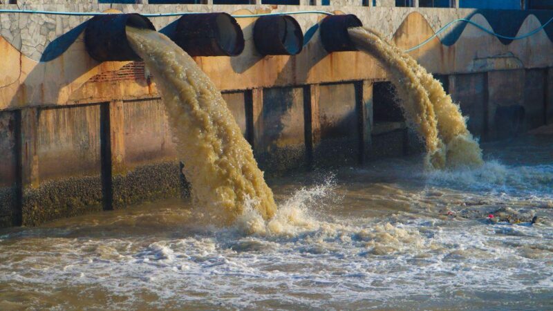 Raw sewage being pumped into water