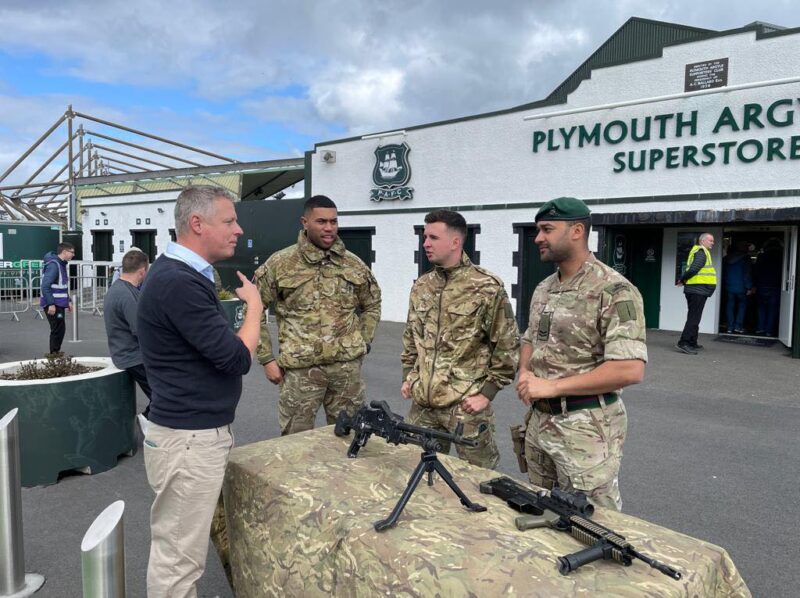 Luke chats with Armed Forces personnel outside Home Park.