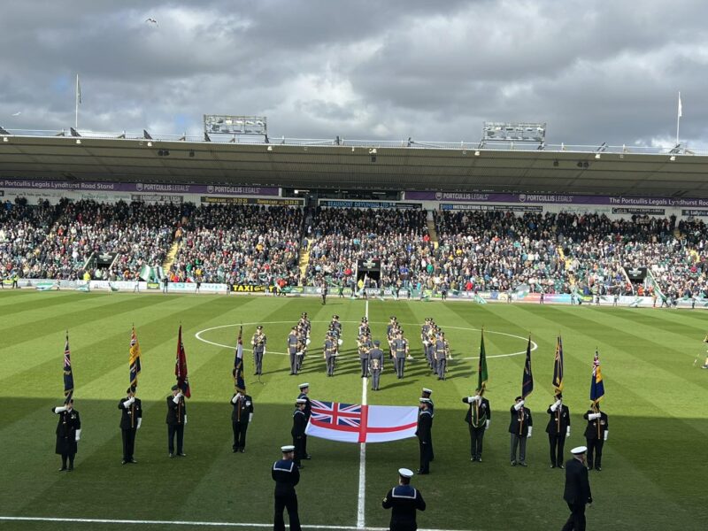 The band of the RAF playing the national anthem on the pitch.