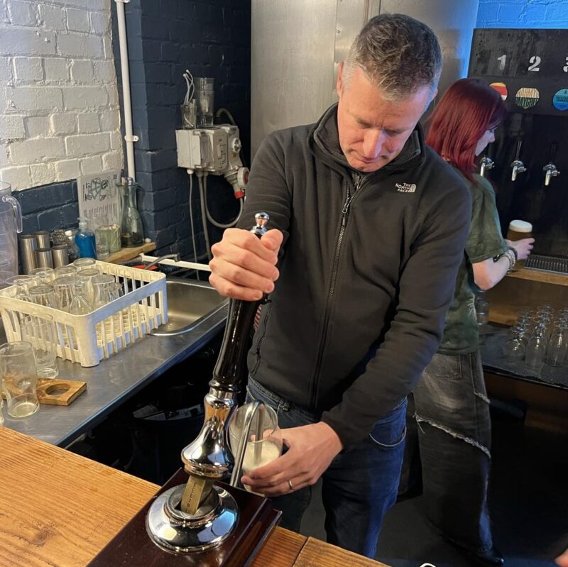 Luke pulling a pint at Roam brewery